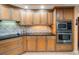 Well-equipped kitchen with ample cabinetry and granite countertops at 5301 Gulf Blvd # E202, St Pete Beach, FL 33706