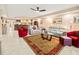 Open living room featuring light leather sofas and area rug at 5301 Gulf Blvd # E202, St Pete Beach, FL 33706