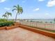 Scenic waterfront view with boats and palm trees at 5301 Gulf Blvd # E202, St Pete Beach, FL 33706