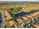 Aerial view showcasing home's location in a community near a lake at 5608 Sunset Falls Dr, Apollo Beach, FL 33572