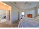 Spacious bedroom with a queen-size bed and access to the bathroom at 5608 Sunset Falls Dr, Apollo Beach, FL 33572
