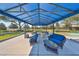 Covered patio with comfortable seating and picnic tables at 5608 Sunset Falls Dr, Apollo Beach, FL 33572