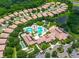Aerial view of community pool, clubhouse and surrounding landscape at 5608 Sunset Falls Dr, Apollo Beach, FL 33572