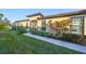 Back exterior view showing access to a screened patio area at 5608 Sunset Falls Dr, Apollo Beach, FL 33572