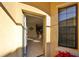 Open front door showing a view into the home's interior at 5608 Sunset Falls Dr, Apollo Beach, FL 33572
