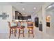 Kitchen with dark wood cabinets, granite counters, and stainless steel appliances at 5608 Sunset Falls Dr, Apollo Beach, FL 33572