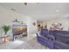 Comfortable living room featuring gray sectional sofa and large TV at 5608 Sunset Falls Dr, Apollo Beach, FL 33572