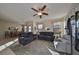 Relaxing living room with comfortable sofas and a ceiling fan at 5608 Sunset Falls Dr, Apollo Beach, FL 33572