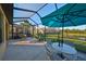 Outdoor patio with table, chairs, and umbrella at 5608 Sunset Falls Dr, Apollo Beach, FL 33572