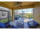 Relaxing screened patio with seating area and view of pond at 5608 Sunset Falls Dr, Apollo Beach, FL 33572