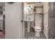 Small bathroom with pedestal sink, toilet and patterned floor at 5901 N Cherokee Ave, Tampa, FL 33604