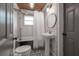Clean bathroom with white subway tile, clawfoot tub, and pedestal sink at 5901 N Cherokee Ave, Tampa, FL 33604