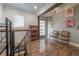 Bright hallway with French doors leading outside and book shelf at 5901 N Cherokee Ave, Tampa, FL 33604