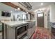 Modern kitchen with farmhouse sink, island, and stainless steel appliances at 5901 N Cherokee Ave, Tampa, FL 33604