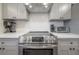 Modern kitchen with stainless steel appliances and white cabinets at 5901 N Cherokee Ave, Tampa, FL 33604