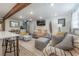 Cozy living room featuring a sofa, armchairs, and a spiral staircase at 5901 N Cherokee Ave, Tampa, FL 33604