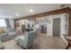 Open living room and kitchen with hardwood floors and stylish furniture at 5901 N Cherokee Ave, Tampa, FL 33604