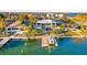 Waterfront home with private dock and boat, aerial view at 6 Treasure Ln, Treasure Island, FL 33706