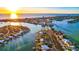 Stunning aerial view of waterfront homes at sunset at 6 Treasure Ln, Treasure Island, FL 33706