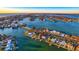 Aerial view showcasing home's waterfront location at 6 Treasure Ln, Treasure Island, FL 33706