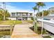 Modern two-story home with private dock and water access at 6 Treasure Ln, Treasure Island, FL 33706