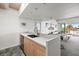 Modern kitchen with island, stainless steel appliances, and water view at 6 Treasure Ln, Treasure Island, FL 33706