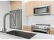 Modern kitchen with stainless steel appliances and sleek countertops at 6 Treasure Ln, Treasure Island, FL 33706