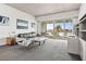 Spacious living room with water views and modern furniture at 6 Treasure Ln, Treasure Island, FL 33706