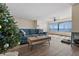 Living room with water view and blue sofa at 6020 Shore Blvd S # 109, Gulfport, FL 33707