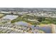 Aerial view of neighborhood with multiple ponds and lush landscaping at 6028 Milestone Dr, Apollo Beach, FL 33572