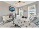 Bedroom with carpet, ceiling fan, and a mounted television at 6028 Milestone Dr, Apollo Beach, FL 33572
