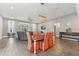 Open concept dining room with seating for six, tile floors and natural light at 6028 Milestone Dr, Apollo Beach, FL 33572