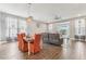 Open concept dining room area featuring tile floors, modern lighting, and comfortable seating at 6028 Milestone Dr, Apollo Beach, FL 33572
