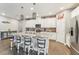 Bright kitchen featuring a central island, stainless steel appliances, and an open layout at 6028 Milestone Dr, Apollo Beach, FL 33572