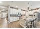 Well-equipped kitchen boasts granite counters, stainless steel appliances, and an island with seating at 6028 Milestone Dr, Apollo Beach, FL 33572