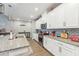 Bright kitchen features granite counters, stainless steel appliances, and white cabinetry at 6028 Milestone Dr, Apollo Beach, FL 33572
