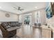 Comfortable living room with a sectional couch, tile floors, and a view of the lanai at 6028 Milestone Dr, Apollo Beach, FL 33572