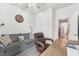 Office featuring a comfortable couch, office chair, wooden desk, and lots of natural light at 6028 Milestone Dr, Apollo Beach, FL 33572