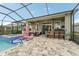 Beautiful outdoor living space with pool, spa, and comfortable seating at 6028 Milestone Dr, Apollo Beach, FL 33572