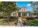 Two story house with front porch and landscaping at 7914 Hampton Lake Dr, Tampa, FL 33647