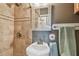 Updated bathroom with tiled shower and pedestal sink at 8829 Bay Pointe Dr # 205, Tampa, FL 33615