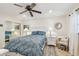 Cozy bedroom with ceiling fan and white bedroom furniture at 8829 Bay Pointe Dr # 205, Tampa, FL 33615