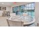 Community room with seating, tables, and pool view at 8829 Bay Pointe Dr # 205, Tampa, FL 33615