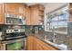 Well-equipped kitchen with granite countertops and stainless steel appliances at 8829 Bay Pointe Dr # 205, Tampa, FL 33615