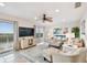 Spacious living room with water views, comfortable furniture, and large TV at 8829 Bay Pointe Dr # 205, Tampa, FL 33615