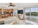 Open living area features water views, kitchen island, and stainless steel appliances at 8829 Bay Pointe Dr # 205, Tampa, FL 33615