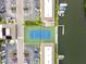 Aerial view of community tennis court and parking at 8829 Bay Pointe Dr # 205, Tampa, FL 33615