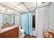 Bathroom with shower/tub and updated vanity at 9209 Seminole Blvd # 209, Seminole, FL 33772