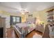 Main bedroom with hardwood floors and ceiling fan at 9209 Seminole Blvd # 209, Seminole, FL 33772