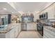Spacious kitchen featuring granite countertops and updated cabinetry at 9209 Seminole Blvd # 209, Seminole, FL 33772